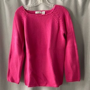 Woman’s pink sweater